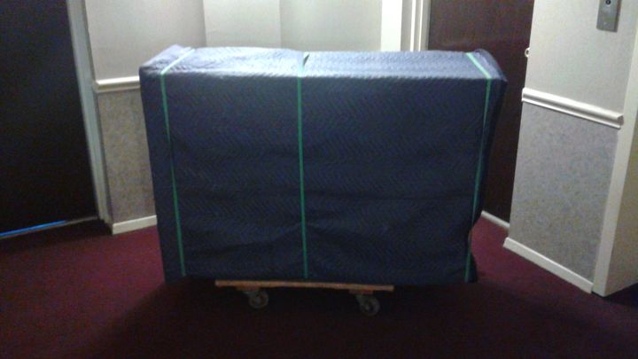 Furniture wrapped in moving blankets on a dolly (Full Service Moving) by Affordable Moving Solutions of Ohio