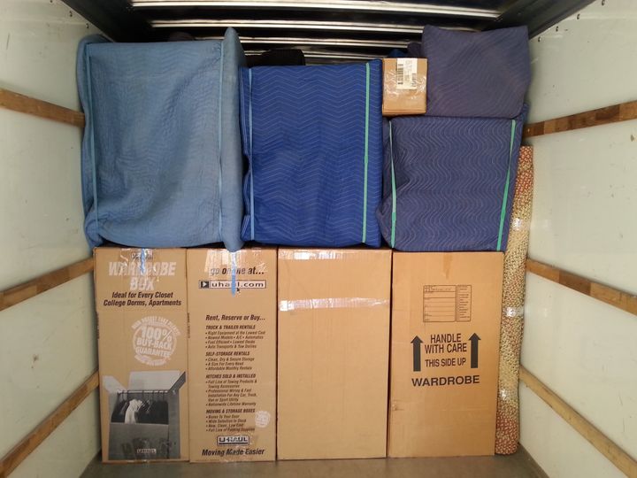 Truck neatly loaded with padded furniture and boxes (Full Service Moving) by Affordable Moving Solutions of Ohio