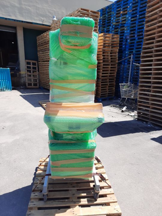 Shrink-wrapped items stacked on a pallet (specialized hauling) by Affordable Moving Solutions of Ohio